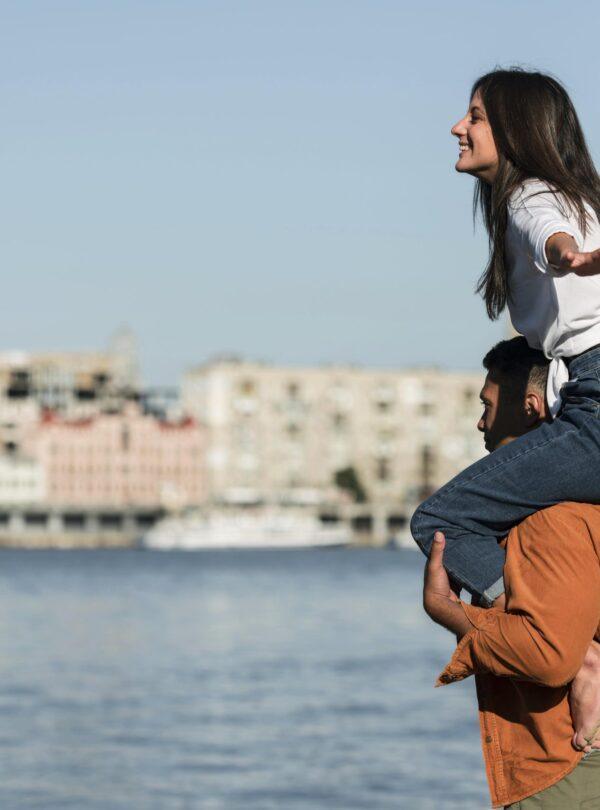 side-view-romantic-couple-enjoying-beach-view
